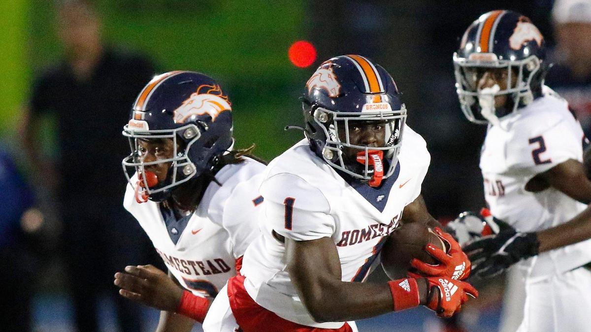 Homestead Broncos running back Isaac Brown (1) carries the ball against Columbus Explorers during the football game on Saturday, October 07, 2023 at Tropical Park Stadium in Miami.