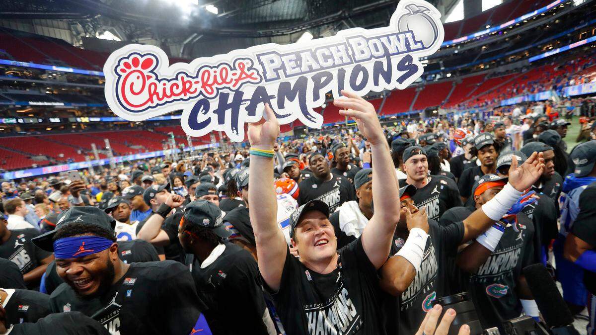 Florida players celebrate after the Peach Bowl NCAA college football game against Michigan, Saturday, Dec. 29, 2018, in Atlanta. Florida won 41-15. (AP Photo/John Bazemore)