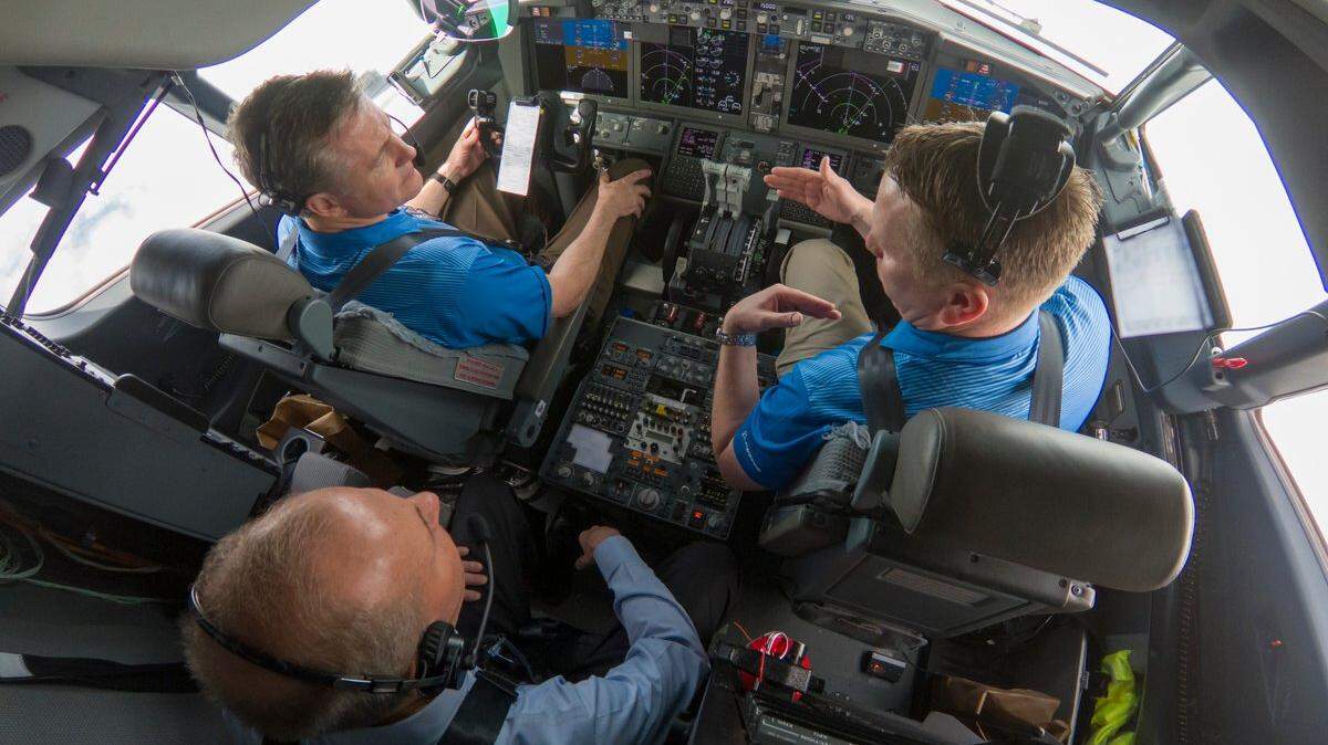 Boeing CEO Dennis Muilenburg sits behind pilots during a flight of a 737 MAX airplane, aimed at demonstrating the performance of a flight control software update. 
