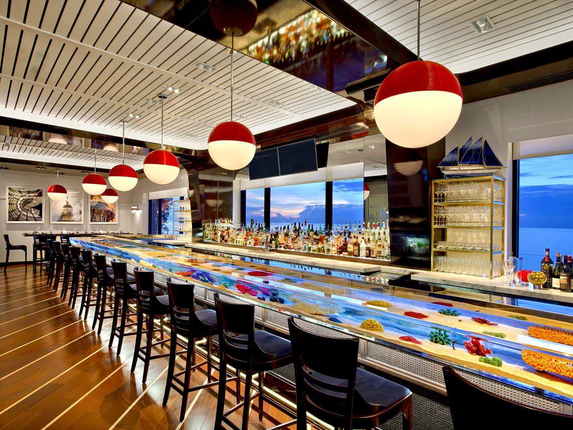 The Seafood Bar at The Breakers in Palm Beach features an aquarium as well as specially crafted drinks.