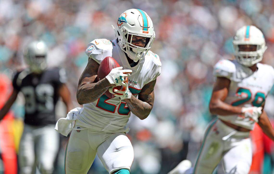 Miami Dolphins cornerback Xavien Howard (25) intercepts in the first quarter as the Miami Dolphins host the Oakland Raiders at Hard Rock Stadium in Miami Gardens on Sunday, September 23, 2018.