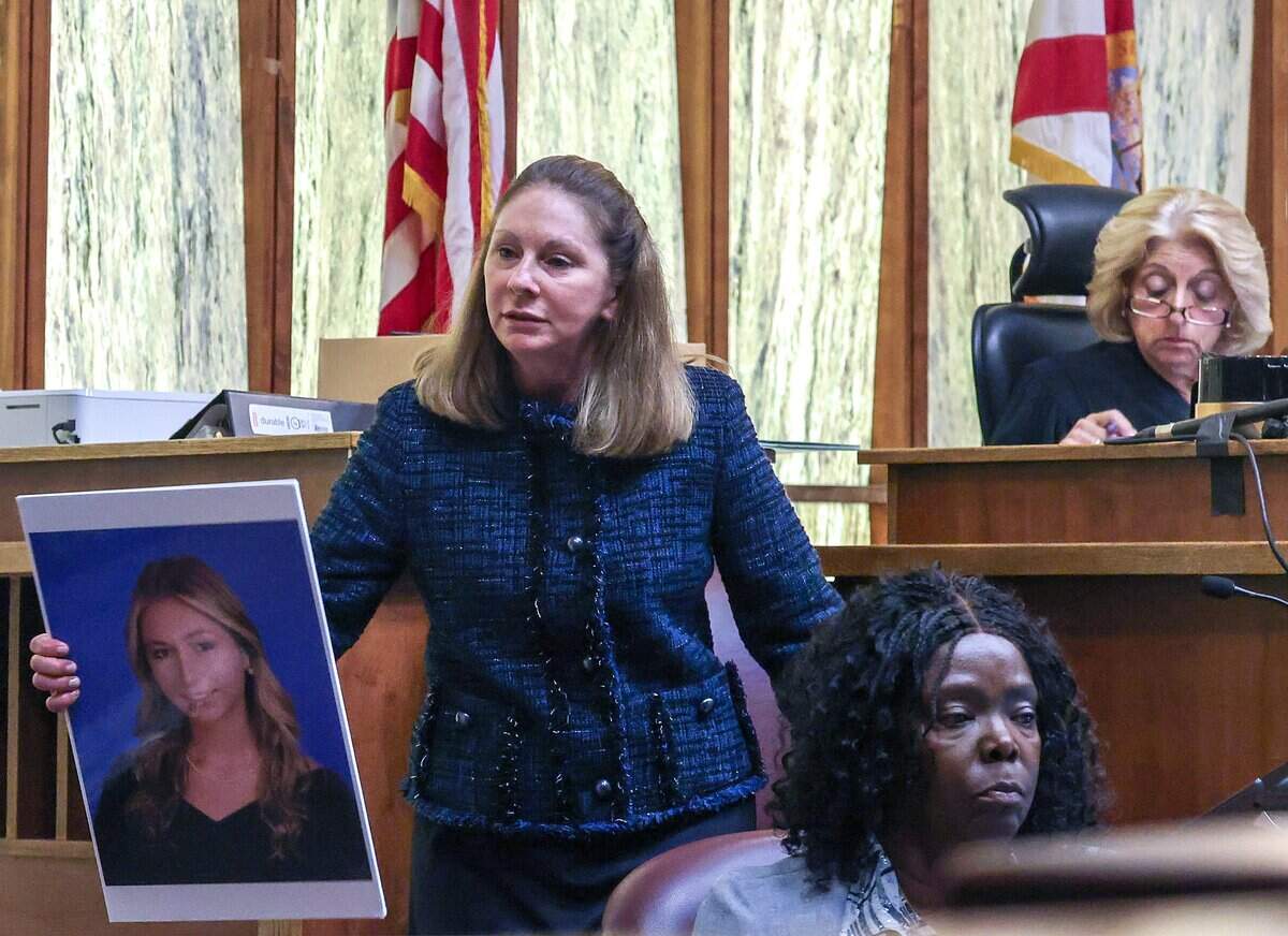 Lead prosecutor Laura Adams holds a photo of Lucy Fernandez recreating the testimony by Pino's wife as she delivered her closing arguments on Monday, June 22, 2026 in Courtroom 4-1 at the Richard E. Gerstein Justice Building in Miami, Florida. Adams urged the jury to find George Pino guilty of manslaughter and vessel homicide charges linked to boat crash that killed Lucy Fernandez.