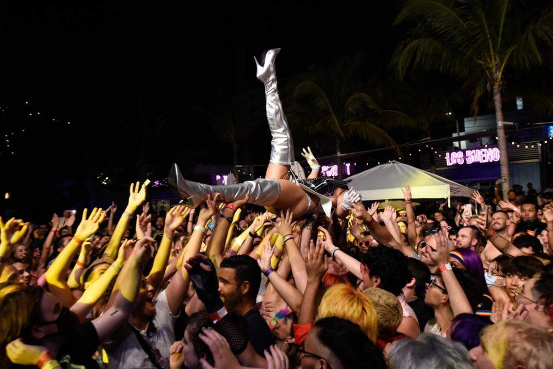 A performer crowd surfs at Wynwood Pride.