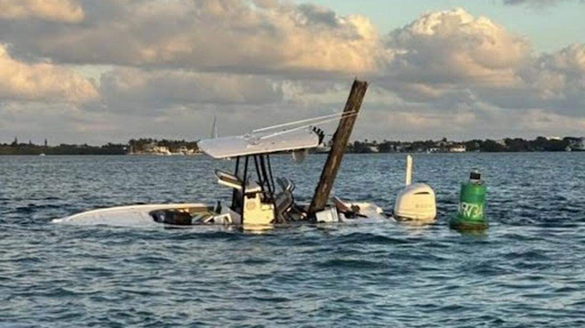 A center-console boat partially sinks off Tavernier in the Florida Keys on Friday, Feb. 20, 2026. Monroe County Fire Rescue said six people on board were ejected after the boat hit a channel marker.