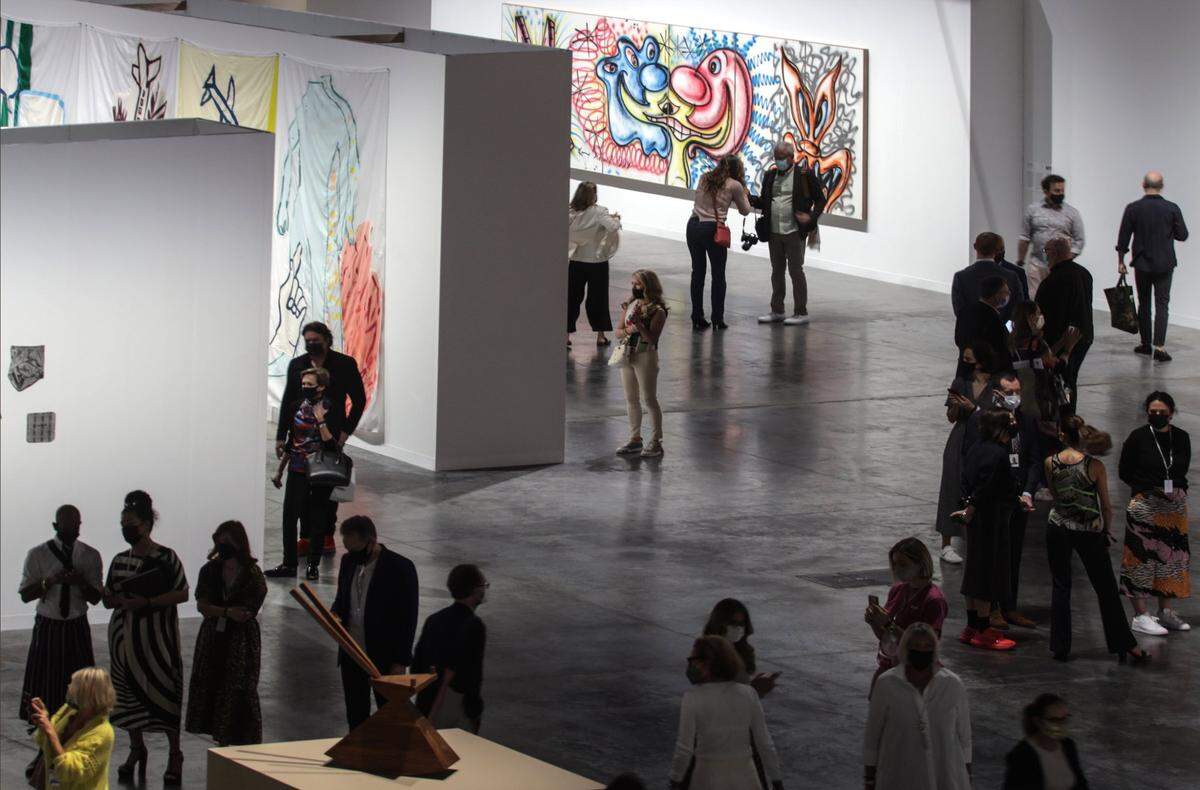 Attendees of the media reception gather for the opening of Art Basel. On Nov. 30, 2021, Art Basel held a media reception with a walk-through of the Meridians installation area inside the Miami Beach Convention Center.