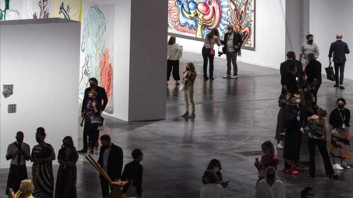 Art Basel held a media reception with a walk-through of the Meridians installation area inside the Miami Beach Convention Center on Tuesday, Nov. 30, 2021. Attendees of the media reception gather for the opening of the fair.