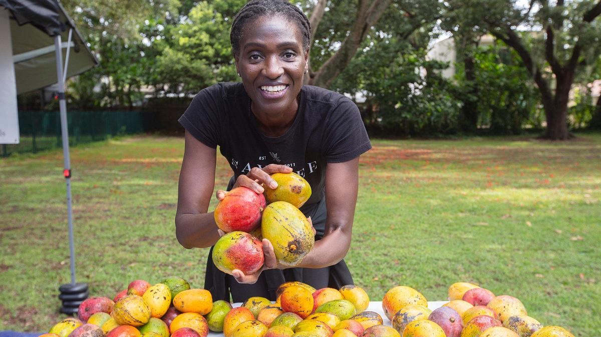 Sayblee Darsale sells mangoes at Legion Park Farmer’s Market in Miami. The 2024 mango season hasn’t been as bountiful as the 2023 season — just ask anyone in Miami.