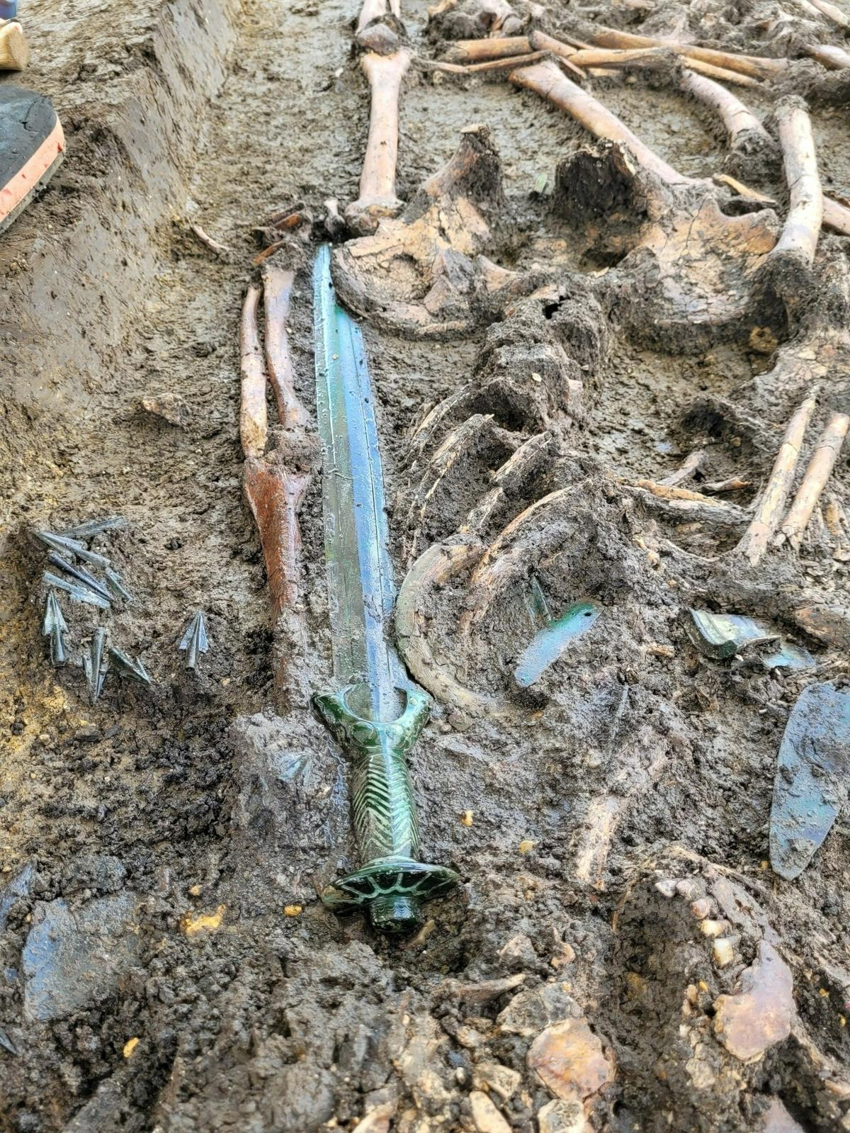 The 3,300-year-old sword sits atop the grave.