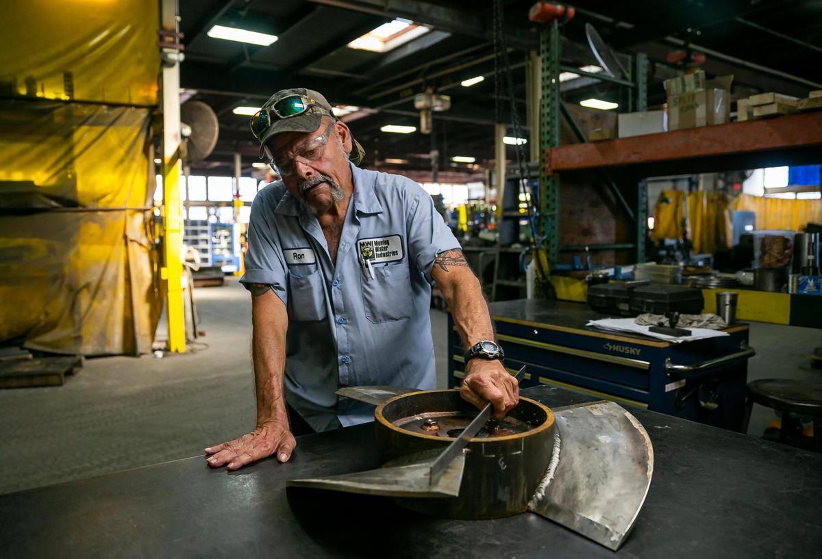 Ron Dhaveloose, a quality insurance coordinator, is seen working at MWI Pumps on Wednesday, Nov. 2, 2022, in Deerfield Beach, Fla.