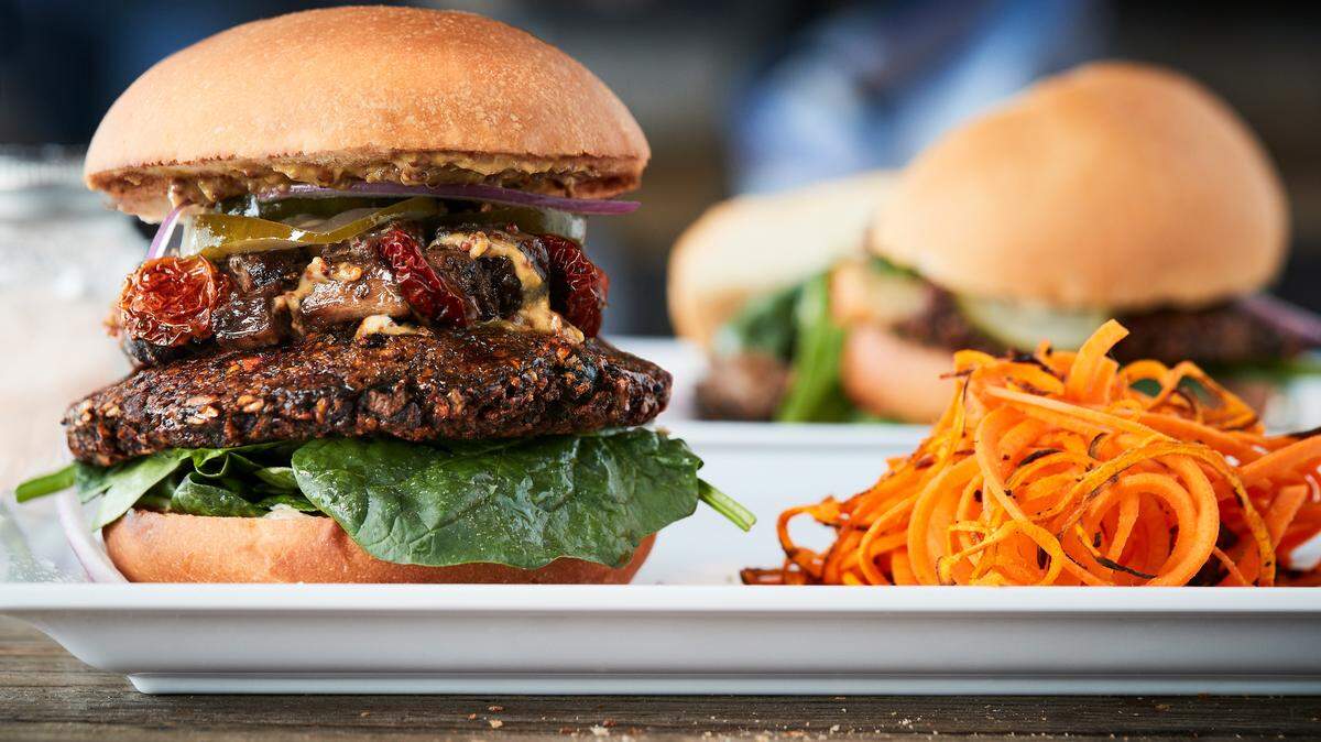 The Nobl Burger is served with truffle-infused garlic dijon. We want a shot of that.