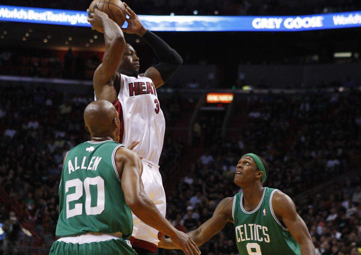 Boston Celtics players Ray Allen (20) and Rajon Rondo (9) are unable to block Miami Heat’s Dwyane Wade from taking a two-point shot in the second half of Game 4 during the first round of the NBA basketball series in Miami, Sunday, April 25, 2010. The Heat won 101-92.