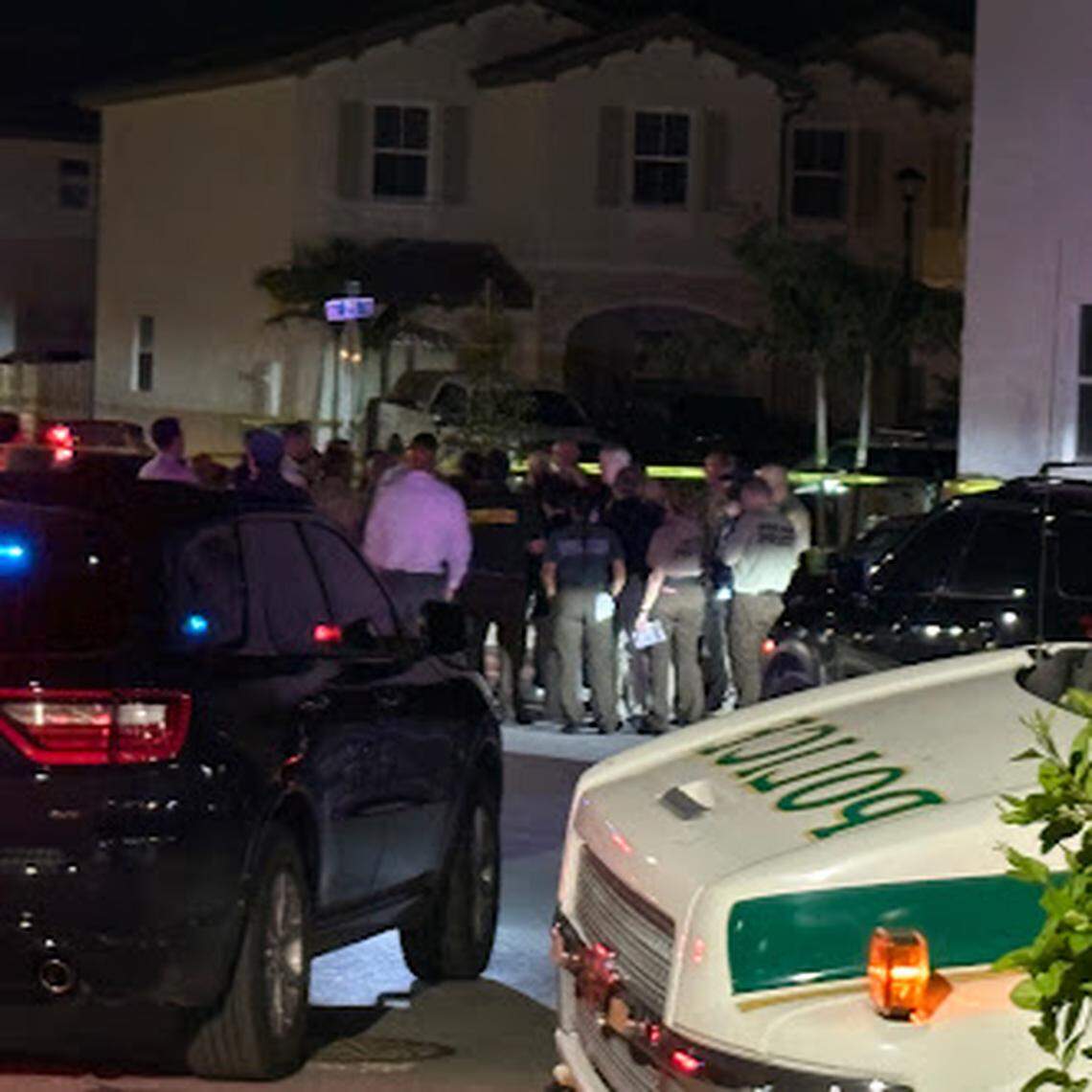 Miami-Dade deputies and detectives gather at Southeast 25th Avenue and 28th Drive in Homestead on Monday night. The sheriff’s office said one or more of its deputies opened fire on a person.