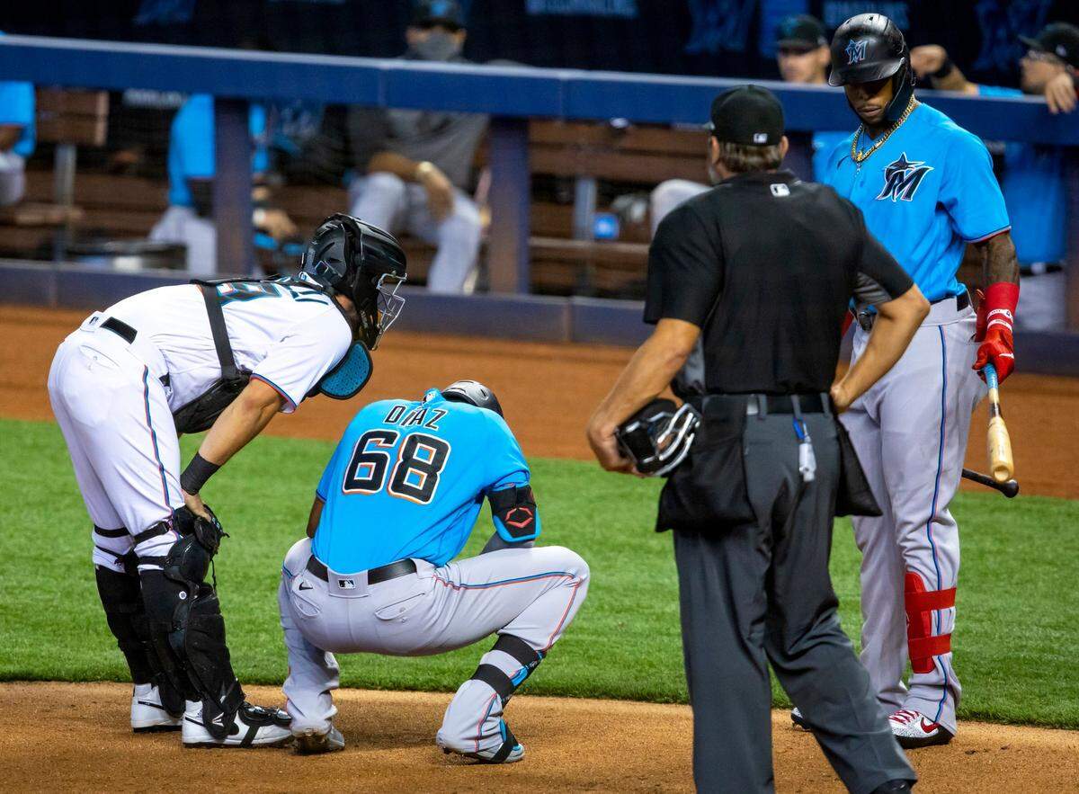 Marlins first baseman Lewin Diaz (68) crouches over after being hit by a pitch during a intra squad simulated game at Marlins Park in Miami, Florida on Saturday, July 18, 2020.