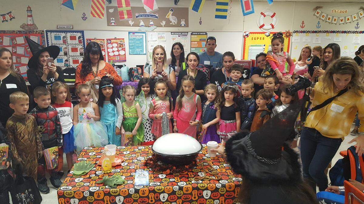 Pre-K and kindergarten students at Leewood K-8 Center in Kendall visited a fifth grade science lab in Halloween costumes to witness a dry ice experience.