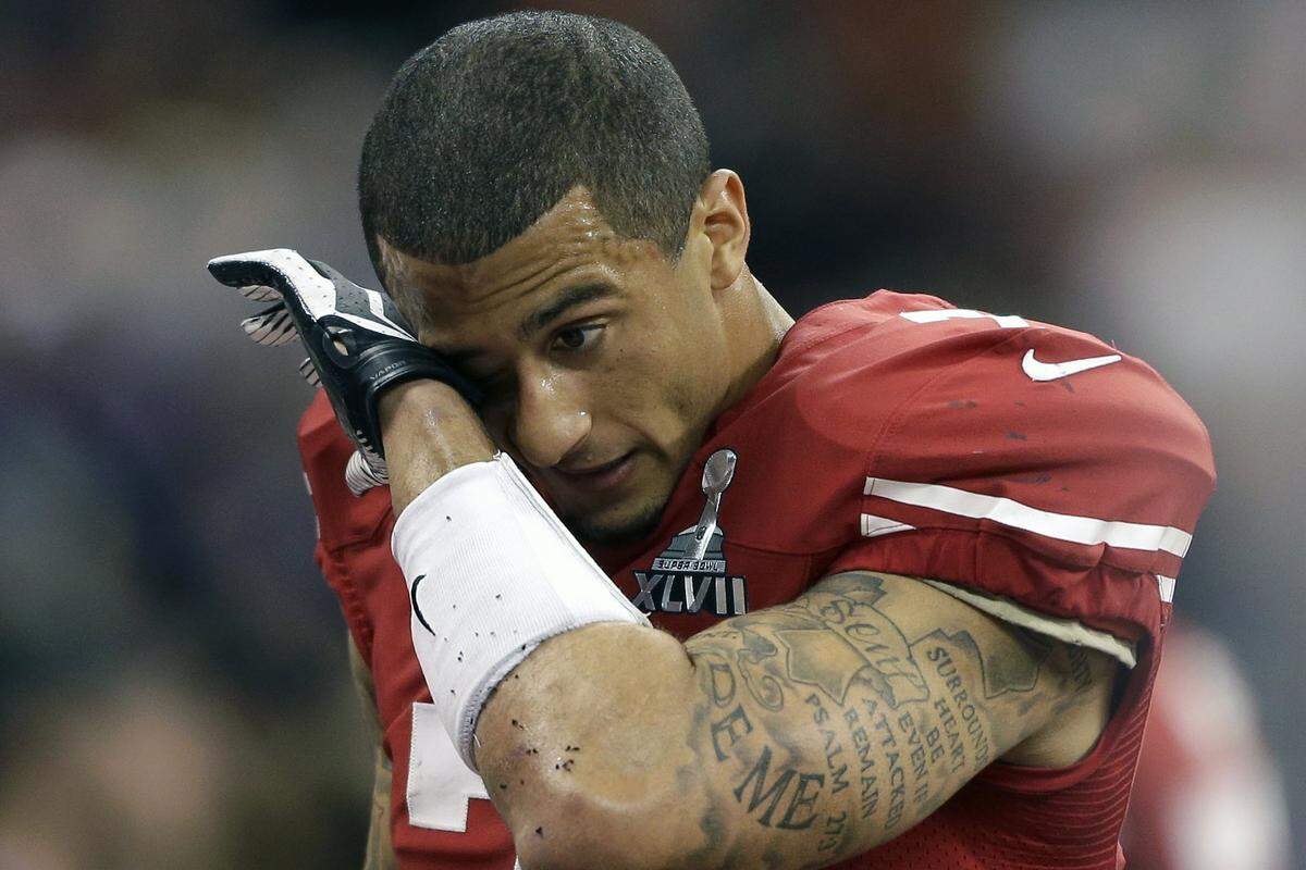 San Francisco 49ers quarterback Colin Kaepernick wipes his face after the 34-31 loss to the Baltimore Ravens in Super Bowl XLVII.