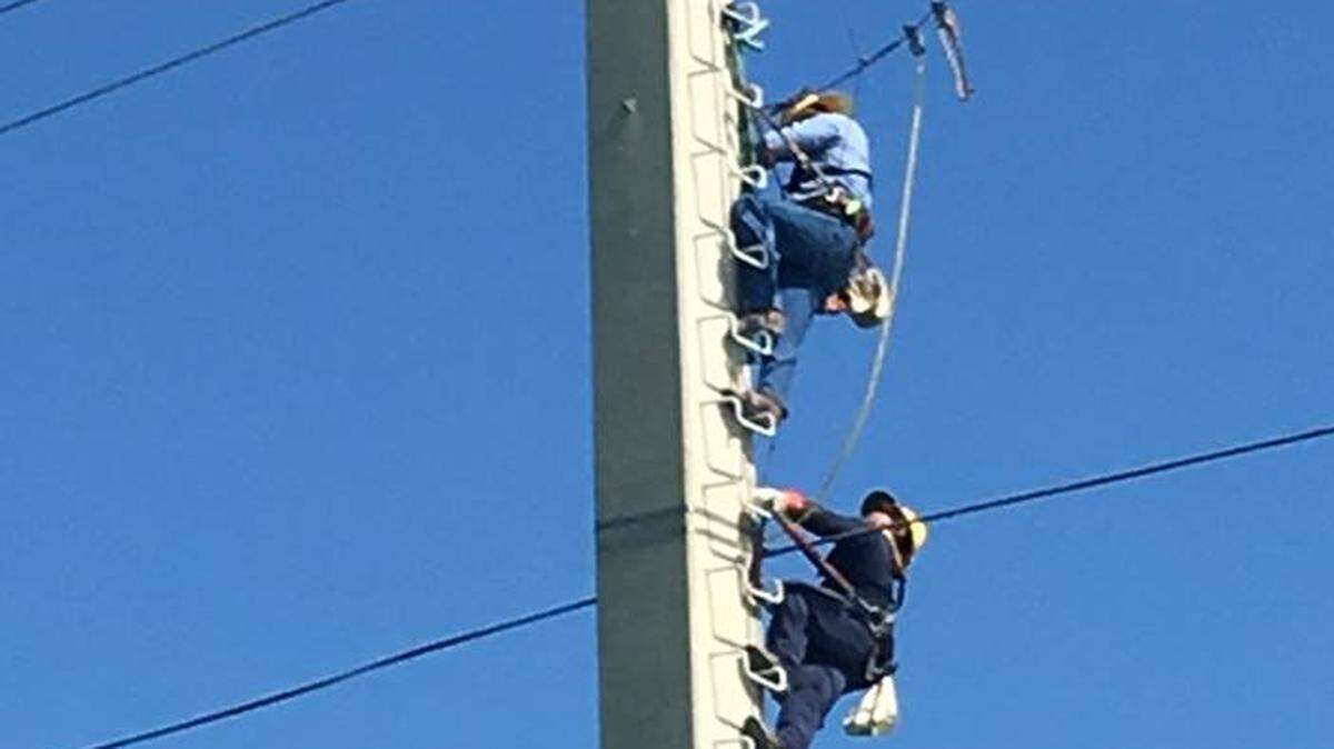 Florida Keys Electric Cooperative linemen work on a power pole in the Florida Keys. A Monroe County Sheriff’s Office investigation into possible theft at the utility revealed questionable spending on tools and equipment that at least one employee was selling online.