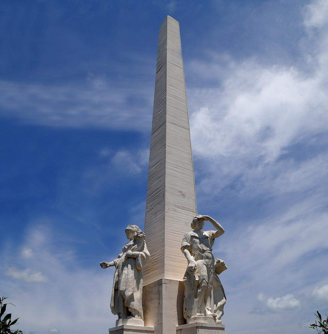 The monument to Henry Flagler, a 110-foot concrete obelisk with four statues, stands at the center of Monument Island.