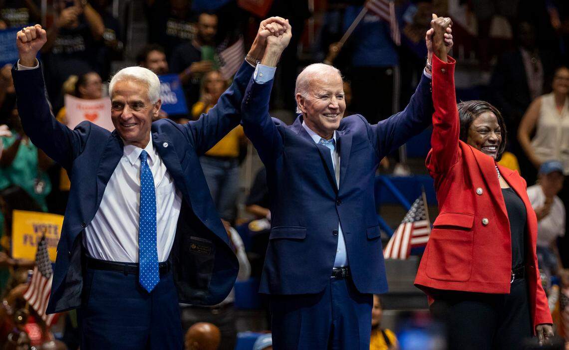 From left to right: Charlie Crist, President Joe Biden and U.S. Rep. Val Demings, D-Fla., greet a crowd of supporters during a political rally at Florida Memorial University on Tuesday, Nov. 1, 2022, in Miami Gardens, Florida. The rally was held in anticipation of the Nov. 8 elections.