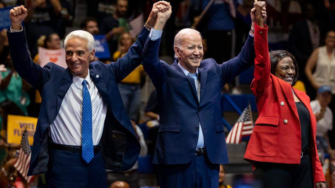 From left to right: Charlie Crist, President Joe Biden, and U.S. Rep. Val Demings, D-Fla., greet a crowd of supporters during a political rally at Florida Memorial University on Tuesday, Nov. 1, 2022, in Miami Gardens, Fla. The rally was held in anticipation of the Nov. 8th elections.