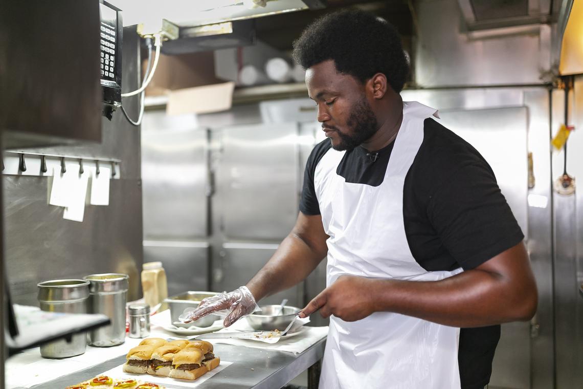 James S. Brimberry, 27, prepares an “Original Royal Castle Burger” inside the last Royal Castle restaurant located in Miami’s Gladeview neighborhood. Brimberry’s grandfather, James N. Brimberry, who at one point owned seven Royal Castles, sold him the last location in existence in 2016. Now, James S. Brimberry is looking to attract customers by restoring the restaurant while maintaining its original style.