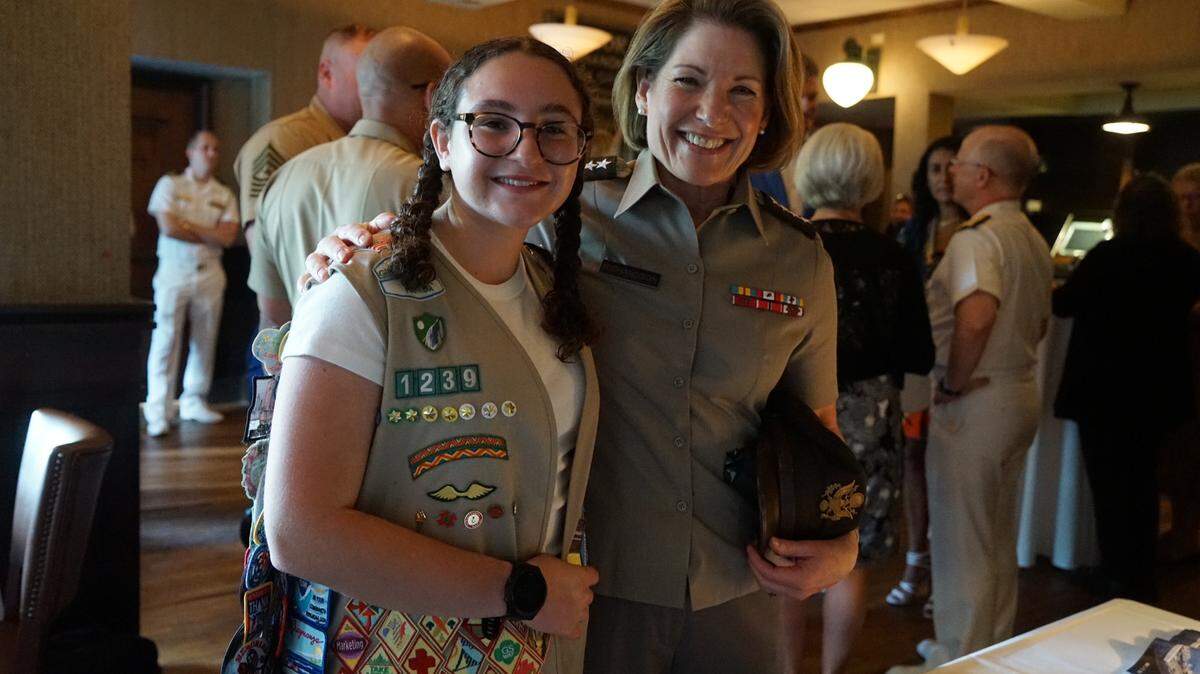The author, Penelope Rose Heller, at a 2024 “Big Deck” hospitality event, welcoming the amphibious assault ship USS Bataan to Miami. Pictured here with retired U.S. Army General Laura J. Richardson.                 