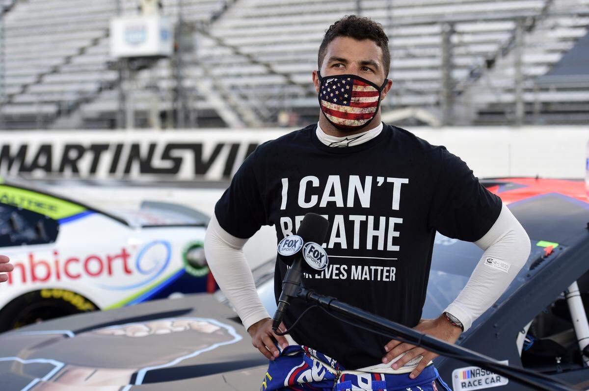 MARTINSVILLE, VIRGINIA - JUNE 10: Bubba Wallace, driver of the #43 Richard Petty Motorsports Chevrolet, wears a “I Can’t Breathe - Black Lives Matter” t-shirt under his fire suit in solidarity with protesters around the world taking to the streets after the death of George Floyd on May 25, speaks to the media prior to the NASCAR Cup Series Blue-Emu Maximum Pain Relief 500 at Martinsville Speedway on June 10, 2020 in Martinsville, Virginia. (Photo by Jared C. Tilton/Getty Images)