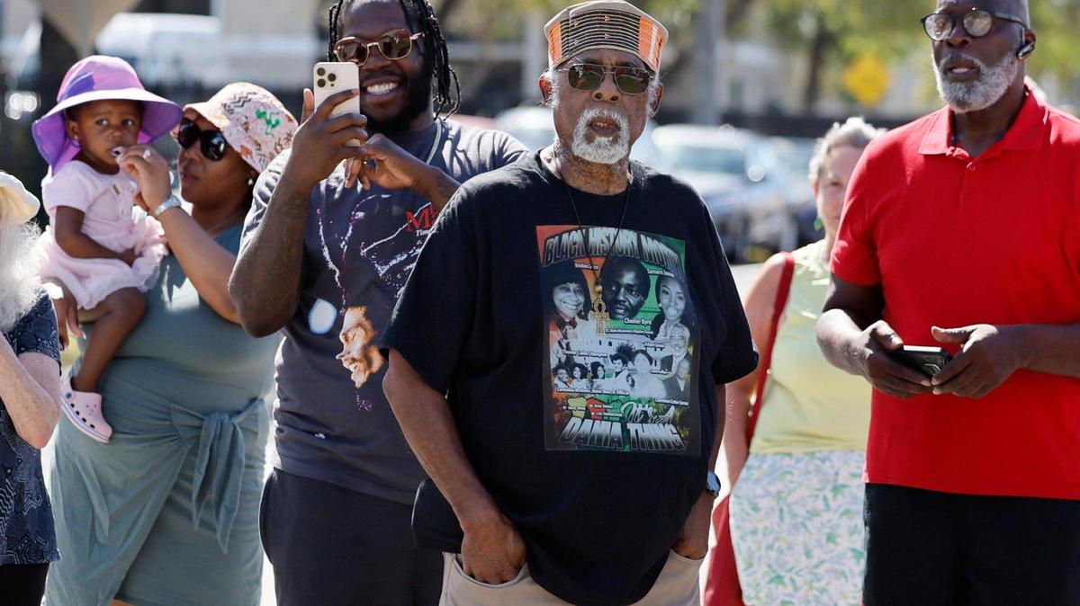 Earl Beneby, center, and others gather for the unveiling of a marker to commemorate Liberia’s history on Saturday, Feb. 15, 2025. Liberia, a historically Black community is in Hollywood, Florida.