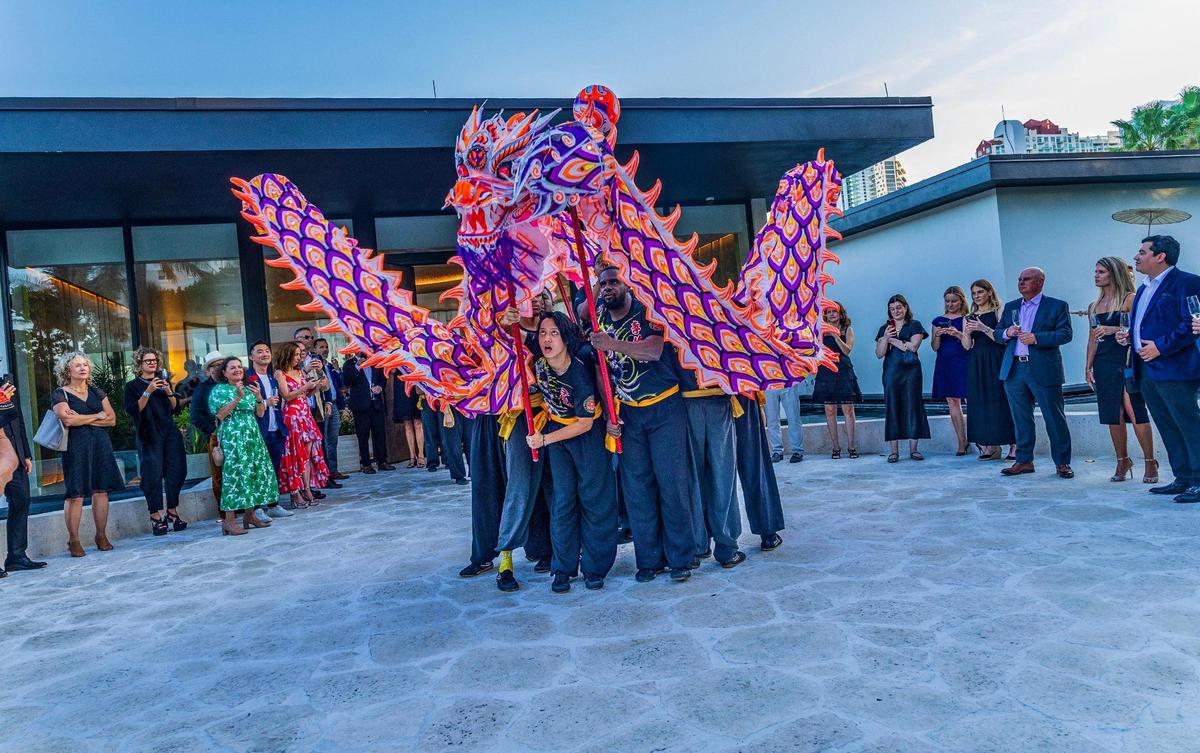 Members of the Lee Koon Hung Lion & Dragon Dance Team perform at the Mandarin Residences sales center on Thursday May 15, 2025.