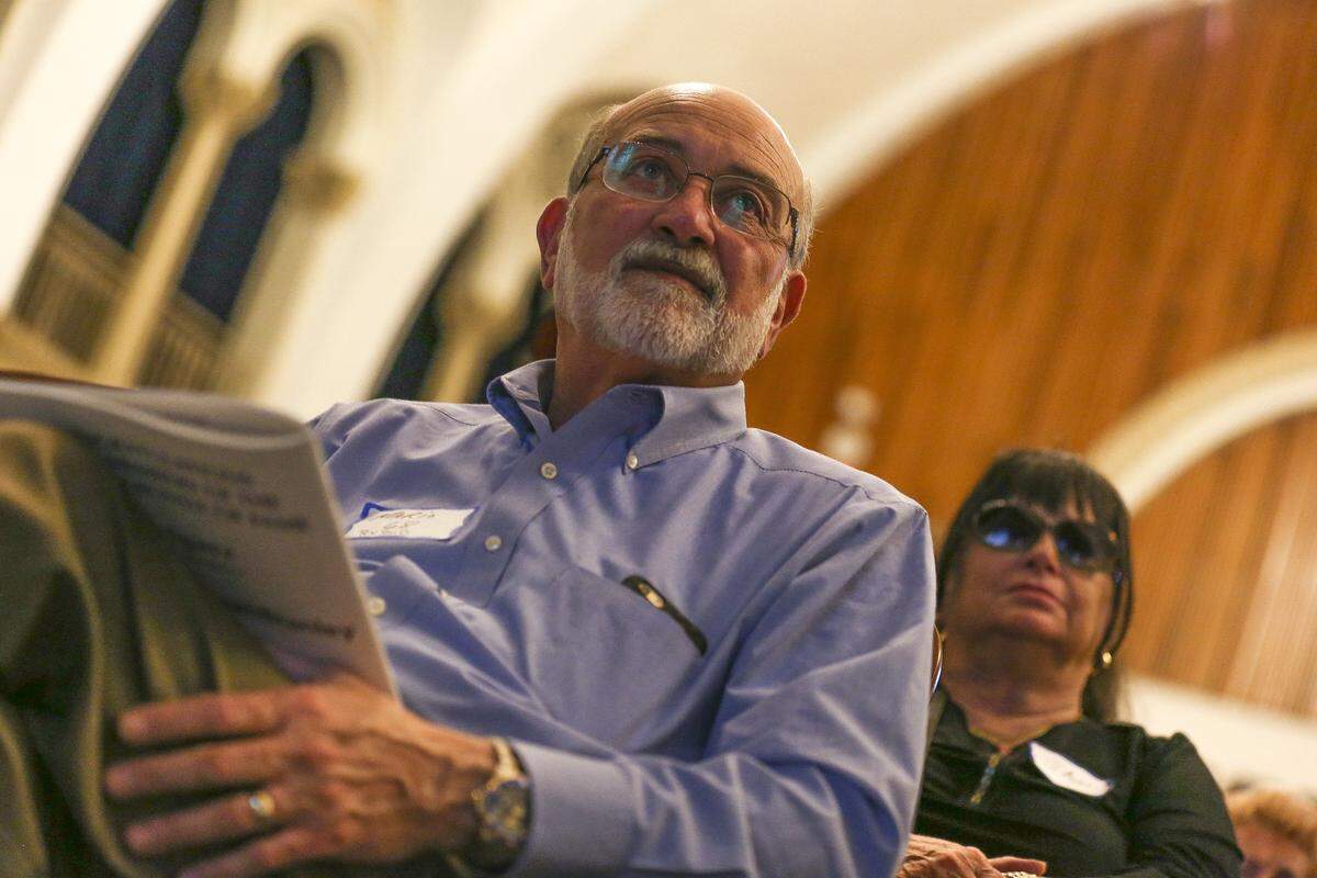 Mario Rubio listens closely during the Miami High School Hall of Fame induction ceremony on Saturday, April 16, 2016. Rubio, from the Class of 1968, was recognized for playing football at the school.