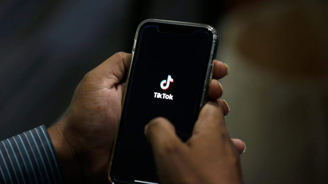 In this July 21, 2020 file photo, a man opens social media app ‘TikTok’ on his cell phone, in Islamabad, Pakistan.