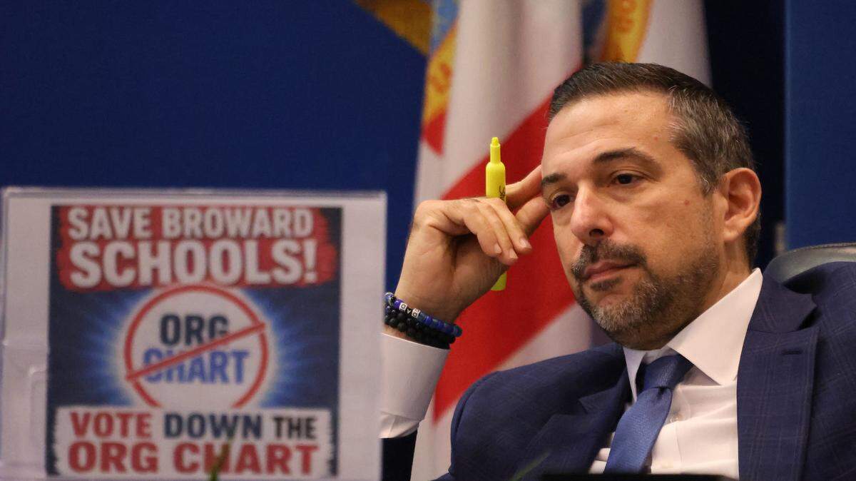 Broward County School Board member Adam Cervera listens to debate during a meeting regarding job cuts on Monday, May 11, in Fort Lauderdale. 