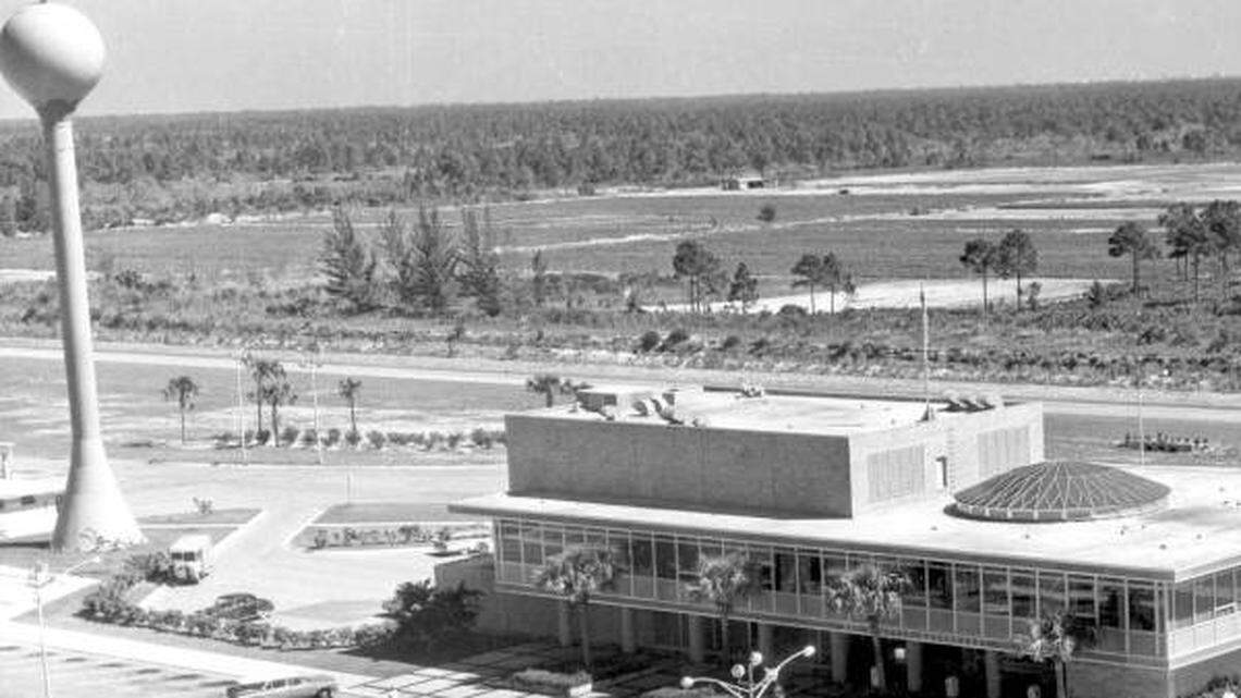 Turnpike service plaza with the landmark orange-topped pole.