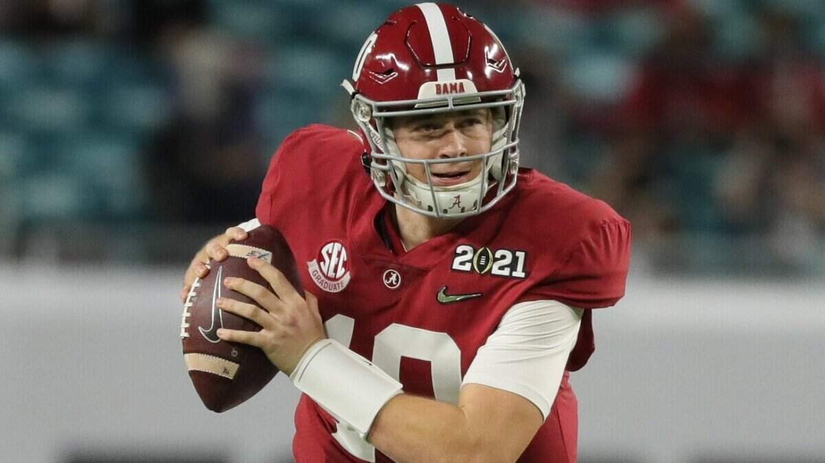 Alabama Crimson Tide quarterback Mac Jones (10) scrambles during the 2021 National Championship game against the Ohio State Buckeyes at Hard Rock Stadium in Miami Gardens on Monday, January 11, 2021.