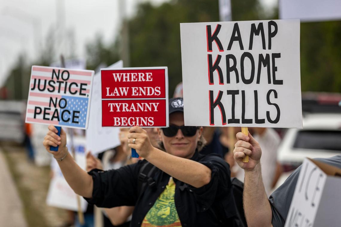 Protesters line the side of the road on SW 177th Avenue and 12th Street to protest conditions inside Krome Detention Center on Saturday, March 29.