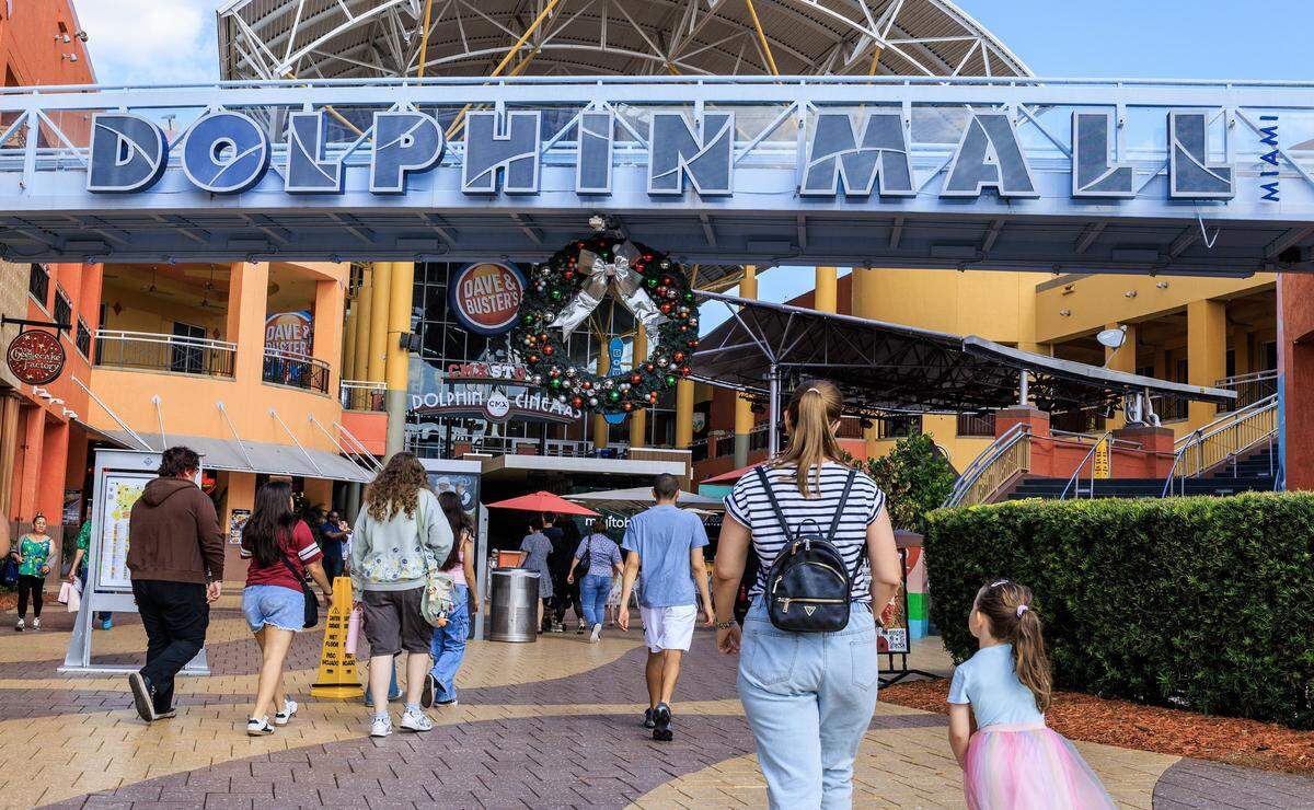 Shoppers enter Dolphin Mall in Sweetwater on Friday, Nov. 21, 2025.