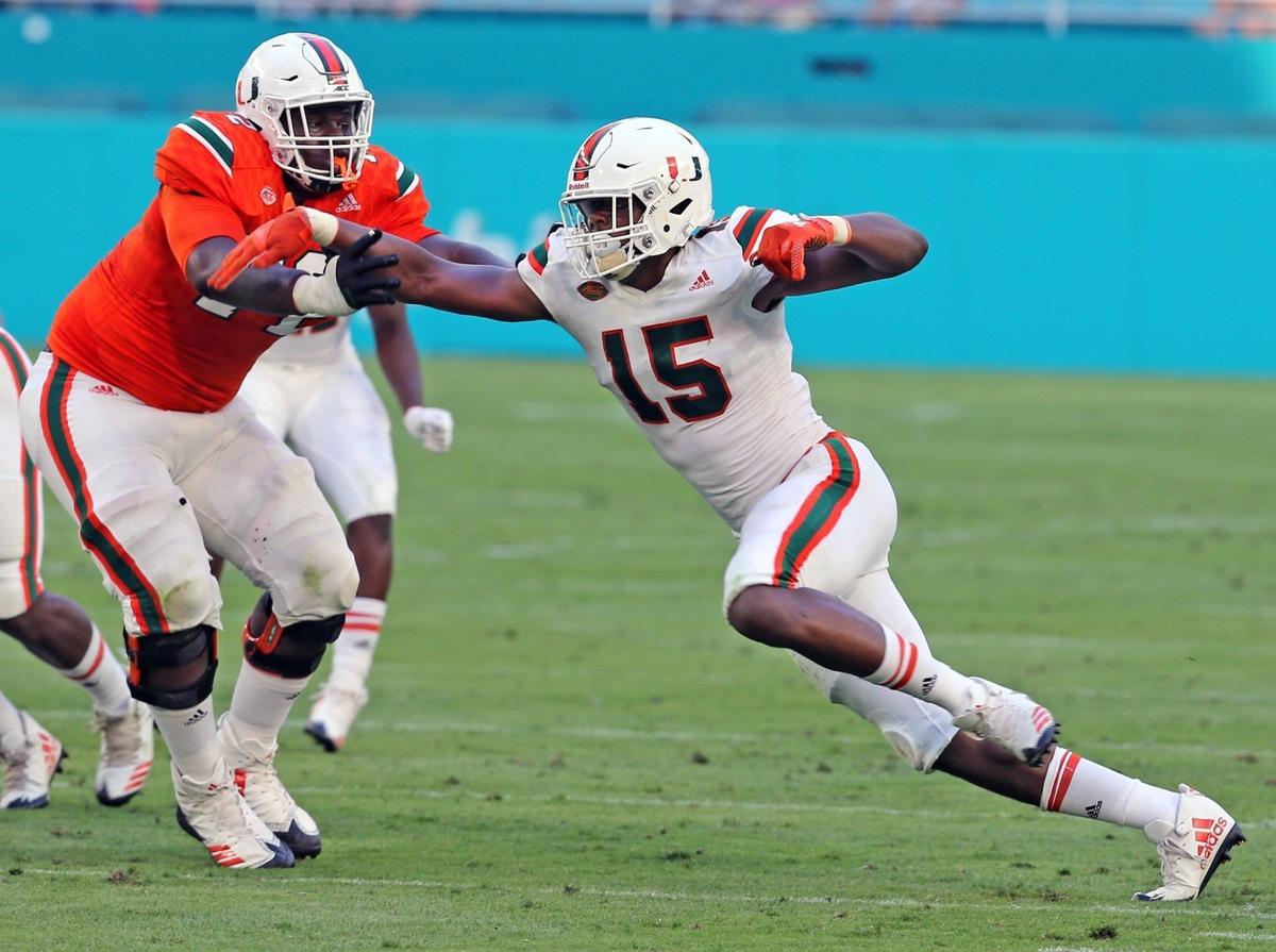 Miami Hurricanes freshmen defensive end Greg Rousseau - seen here rushing against teammate John Campbell in UM’s spring game - is back after missing most of last season with a fractured right ankle.