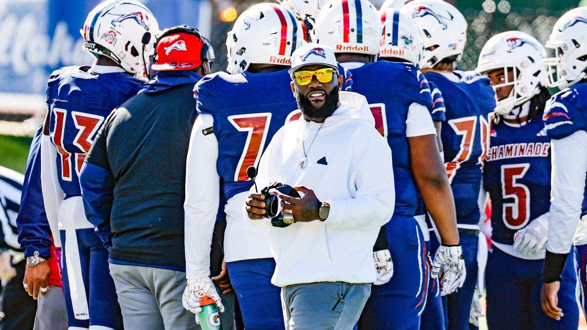 Chaminade-Madonna Lions coach Dameon Jones works with players against the Clearwater Central Catholic Marauders in the Class 1M, Region 3, District 6, State Championship game at Bragg Memorial Stadium in Tallahassee, Florida, on Thursday, December 7, 2023.