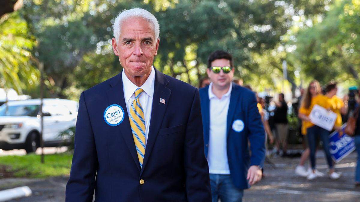 Austin Durrer, former gubernatorial campaign manager for Charlie Crist, walks behind the candidate as he heads toward the polls to vote in person on Election Day during the Florida primary at Gathering Church, 4400 Shore Acres Blvd NE, on Tuesday, Aug. 23, 2022 in St. Petersburg.