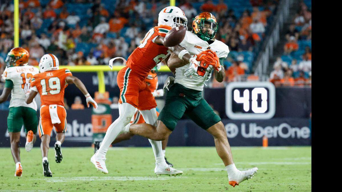 Miami Hurricanes defensive back Zaquan Patterson (20) blocks a pass intended for Florida A&M Rattlers running back Kelvin Dean (9) in the first half at Hard Rock Stadium in Miami Gardens, Florida, on Saturday, September 7, 2024.