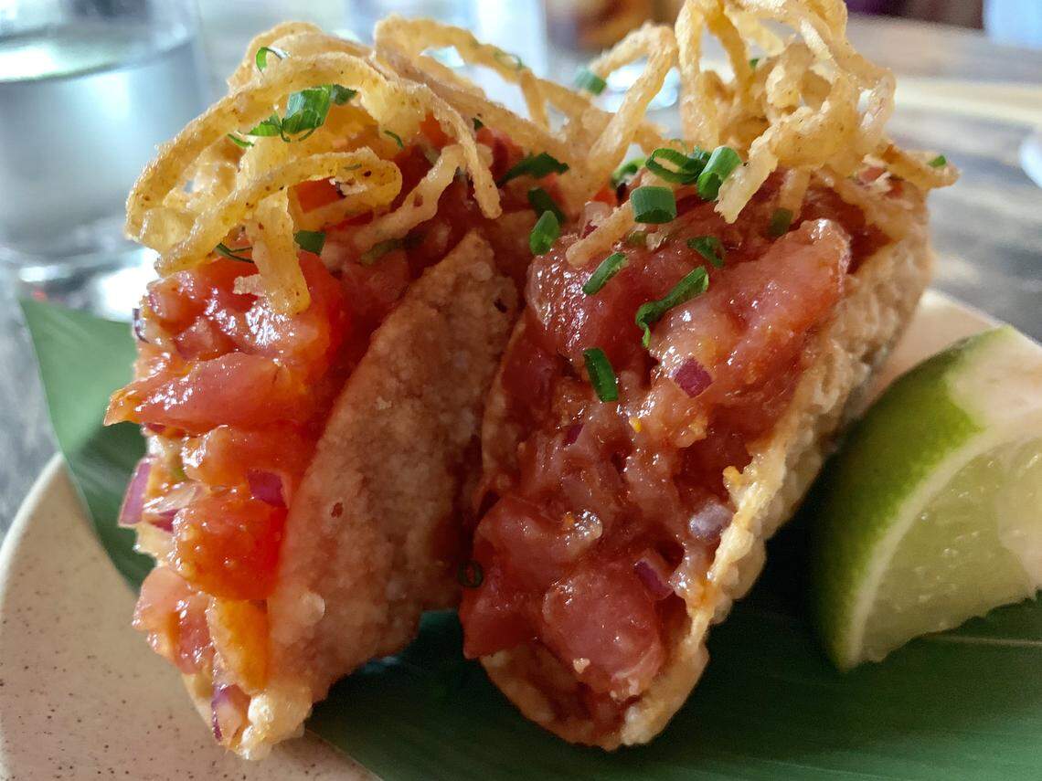 Spicy Tuna taquitos topped with crispy onions and garnished with ginger and cilantro at Pubbelly Sushi Dadeland.