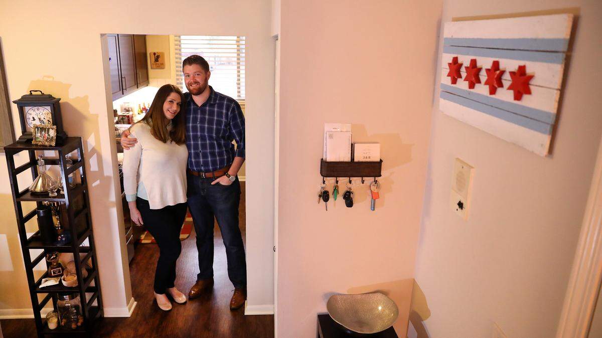 Jessica Doane and Russ Page pose for a portrait in their Libertyville apartment on Wednesday, April 5, 2017. The couple plans on purchasing their first home in Chicago soon. (Chris Sweda/Chicago Tribune/TNS)