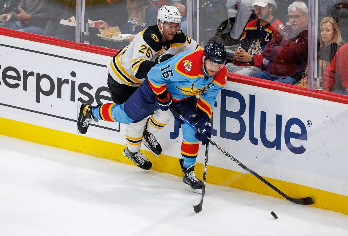 Florida Panthers center Aleksander Barkov (16) battle for the puck against Boston Bruins defenseman Brandon Carlo (25) during the second period of an NHL game at FLA Live Arena on Wednesday, November 23, 2022 in Sunrise, Fl.