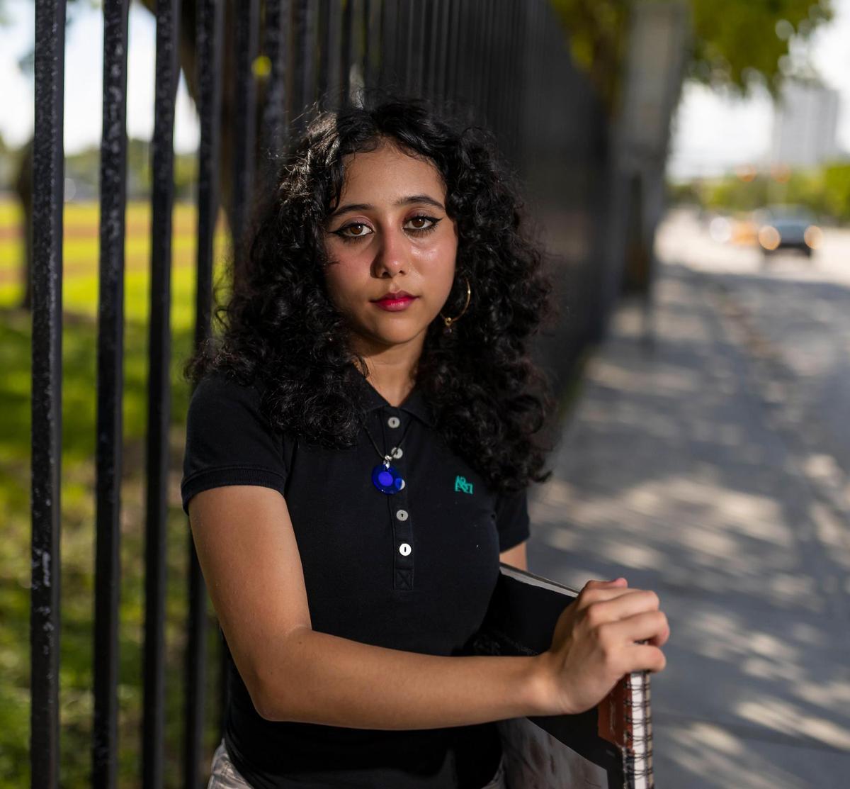Allison, 15, an 11th-grader at Booker T. Washington Senior High in Miami, is photographed outside of her school on Tuesday, Oct. 11, 2022.
