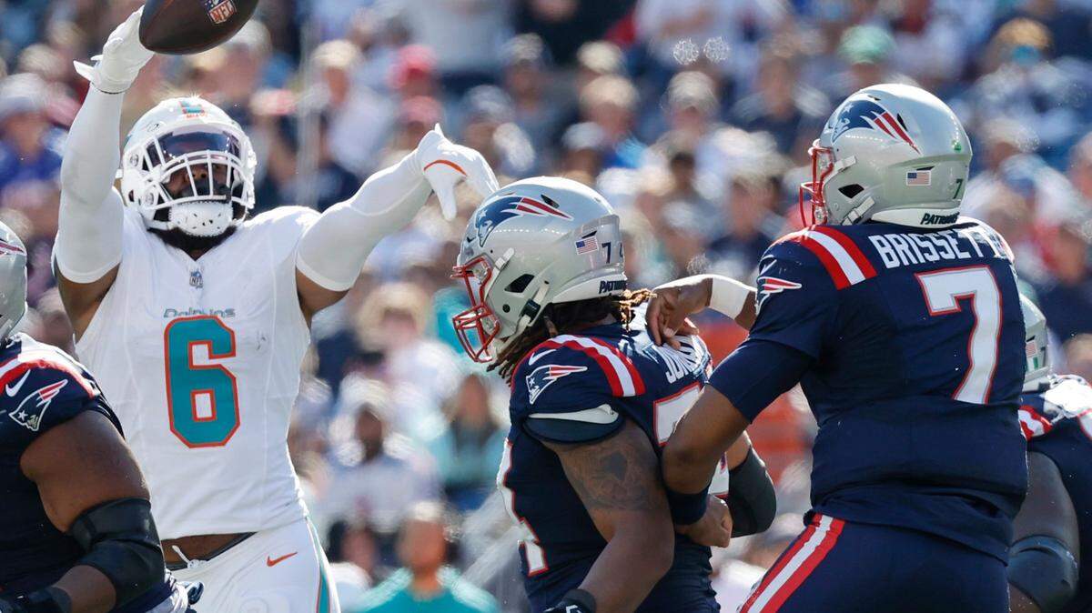 Miami Dolphins linebacker Anthony Walker Jr. (6) deflects a pass by New England Patriots quarterback Jacoby Brissett (7) in the first half of their NFL football game at Gillette Stadium in Foxborough, Massachusetts on Sunday, October 6, 2024.