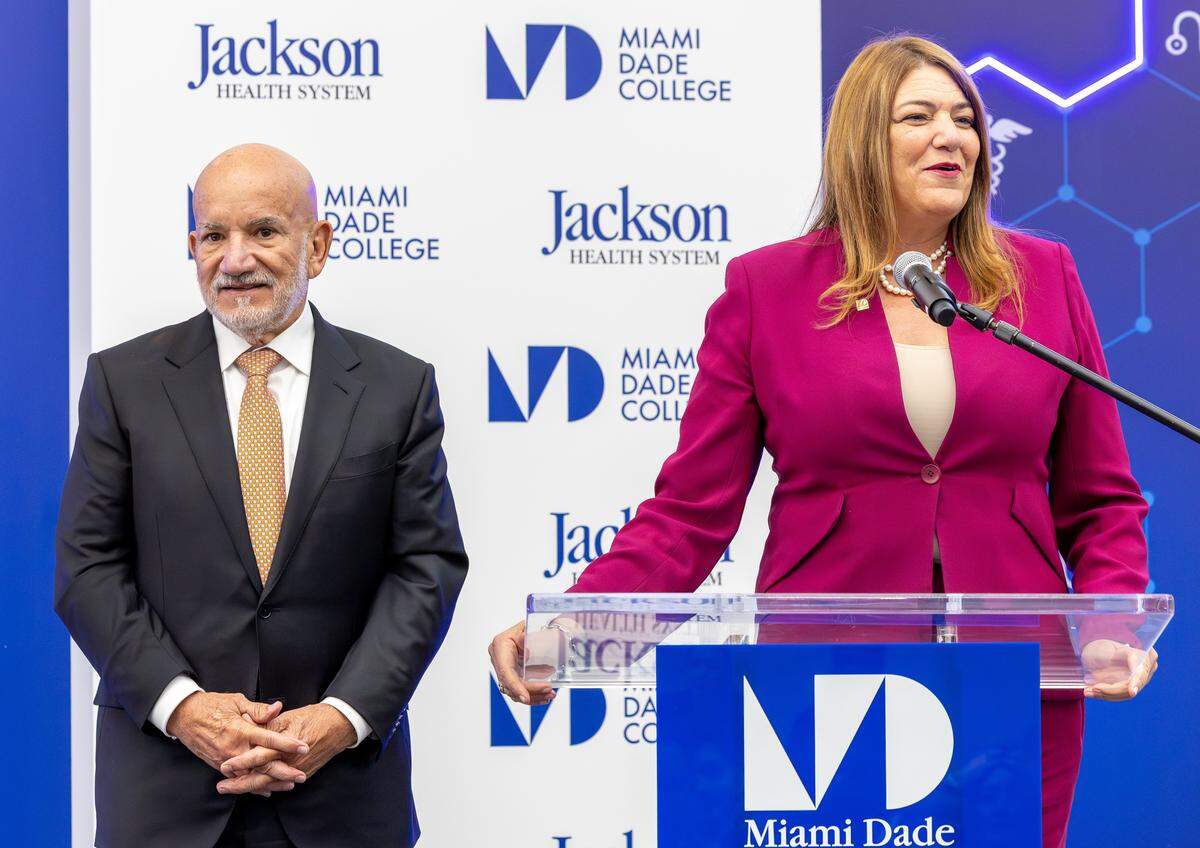 Madeline Pumariega (right), president of Miami Dade College, speaks beside Carlos Migoya, CEO of Jackson Health System, during a press conference at the MDC Medical Campus on Monday, May 18, 2026, in Miami, Fla. 