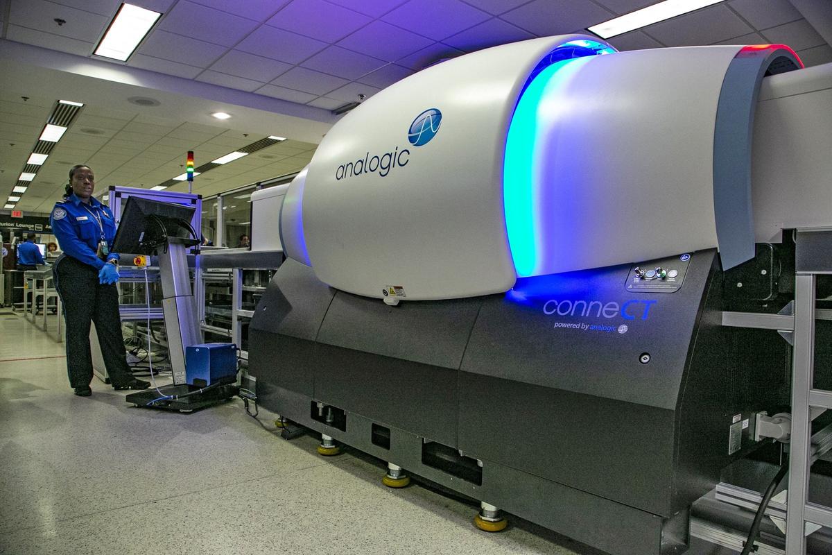 Security training instructor Roselie Pierre oversees the operation of the new TSA checkpoint 3-D explosives detection scanner at Miami International Airport on Tuesday, May 21, 2019.