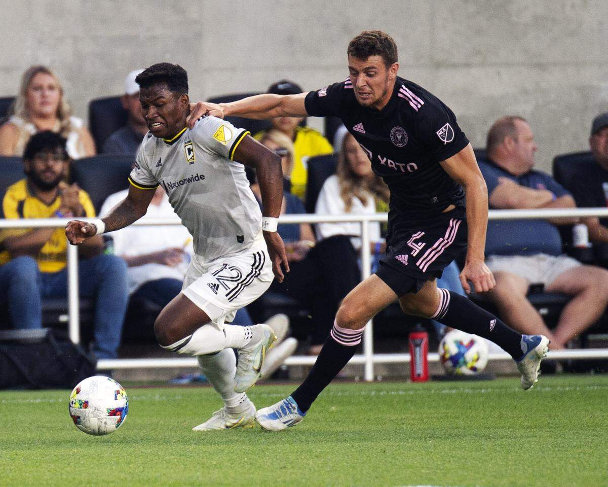 August 31, 2022: Columbus Crew midfielder Luis Daz (12) gets held back by Inter Miami defender Christopher McVey (4) in their match in Columbus, Ohio.