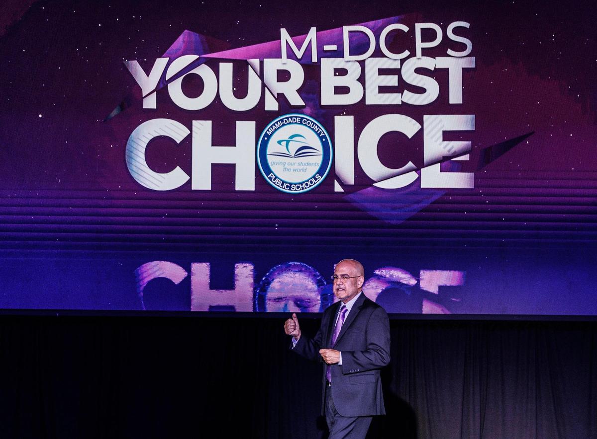 Miami-Dade Schools superintendent Jose Dotres speaks during the 2023- 2024 Opening of Schools event at Miami Senior High School in Miami, on Friday, Aug. 11, 2023. The slogan behind him is part of the district’s effort to market the schools in the wake of the expanded state voucher program.