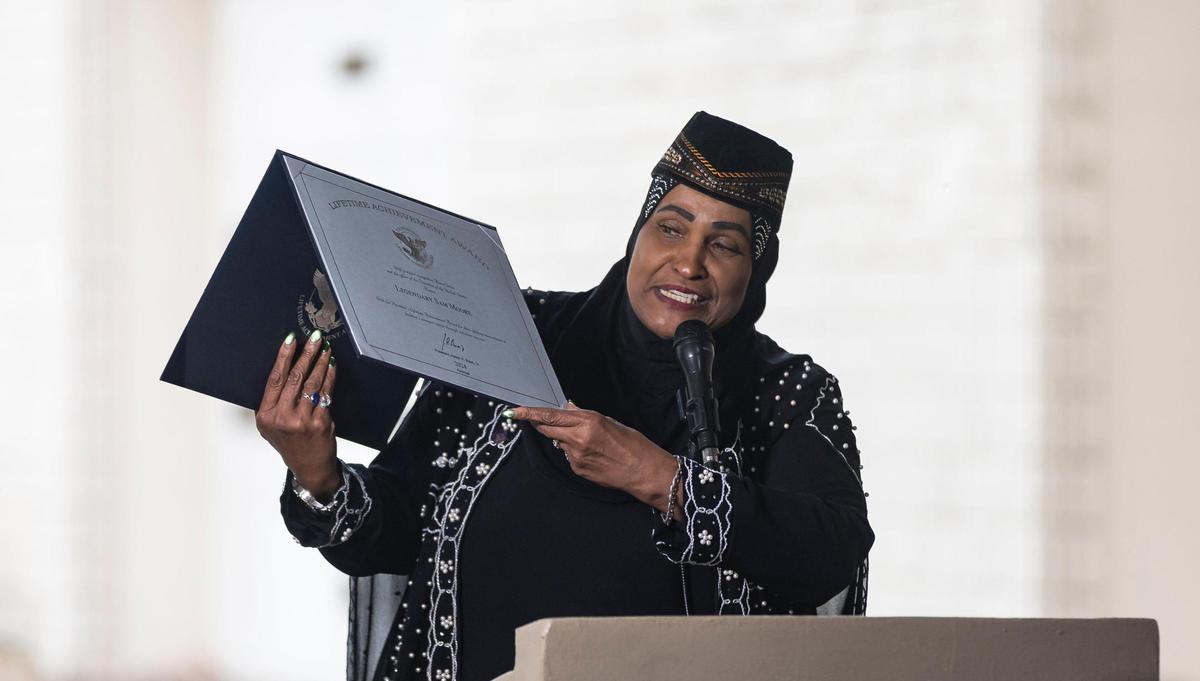 Khalilah Ali, former wife of Muhammad Ali, presents the family of the late Sam Moore with the Presidential Lifetime Achievement Award during his funeral service at Lakeside Memorial Park and Funeral Home on Friday, Jan. 17, 2025, in Doral, Fla. Moore, the R&B singer from the famed 1960s duo Sam & Dave, died on Friday, Jan. 10, at the age of 89.