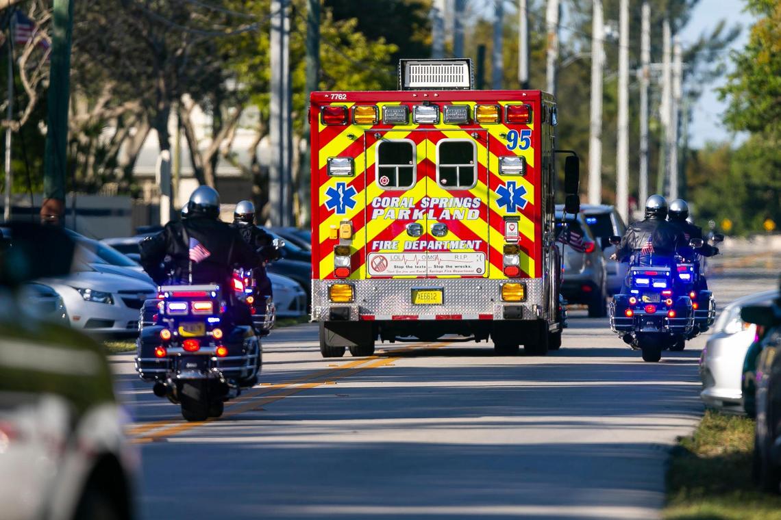 A police motorcade leaves from the Broward County Office of Medical Examiner and Trauma Services in Fort Lauderdale, Florida, on Tuesday, February 2, 2021.